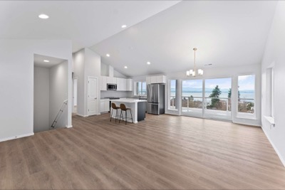 Great room of a completed home, vaulted ceiling and valley view