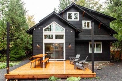 Completed modern home with a full-width entertaining deck