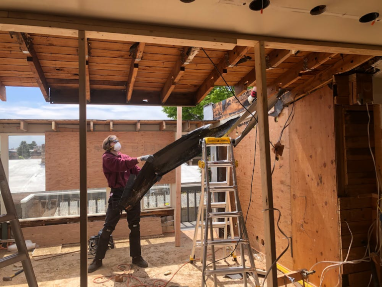 man working on a house renovation