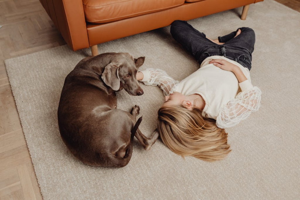 Woman Lying on the Floor with a Dog